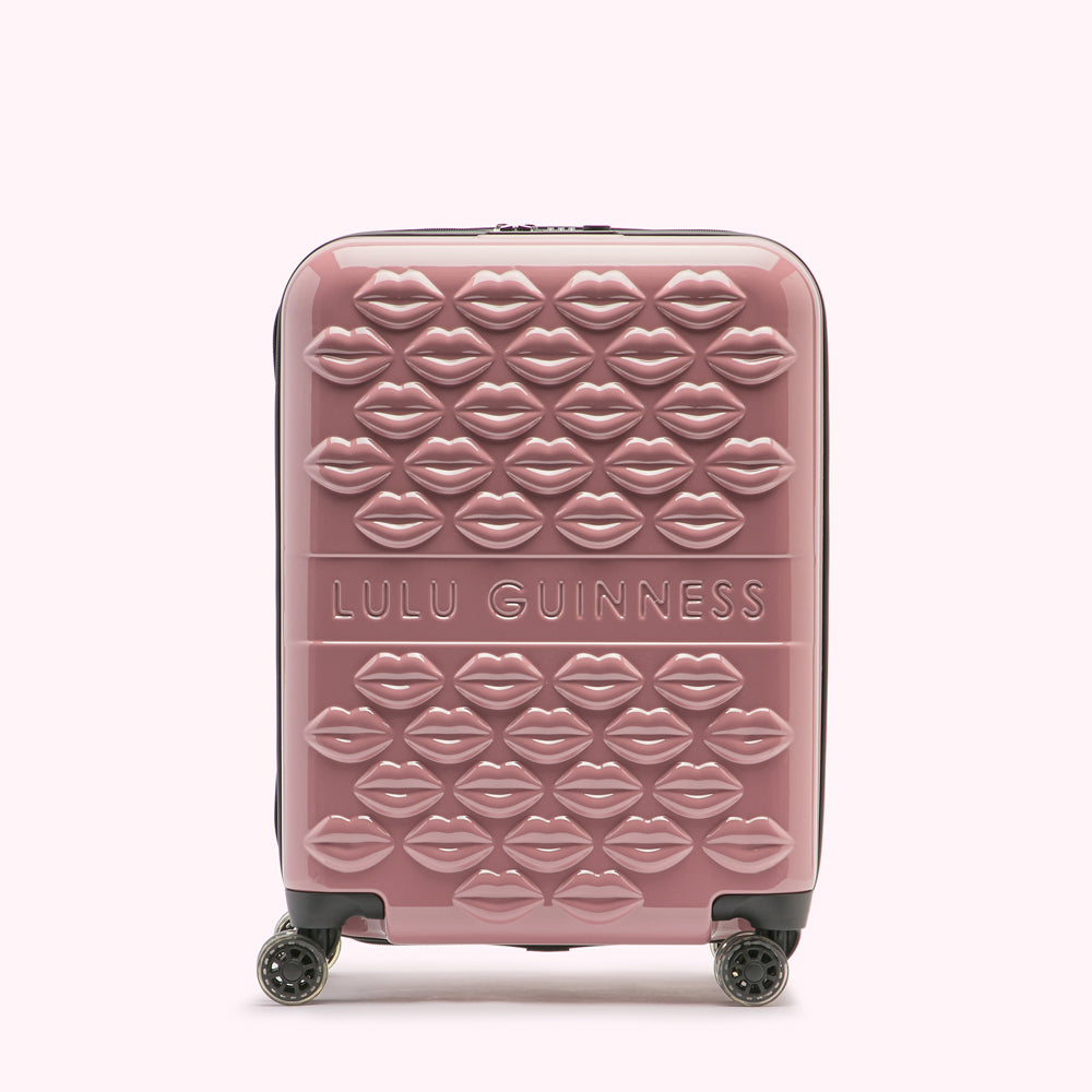 Pink Lulu Guinness suitcase with a lip design.