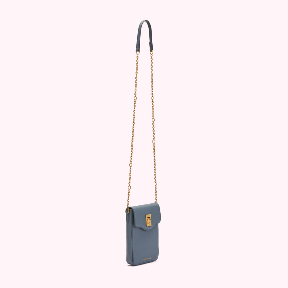 A dusty blue crossbody bag with a gold chain strap.