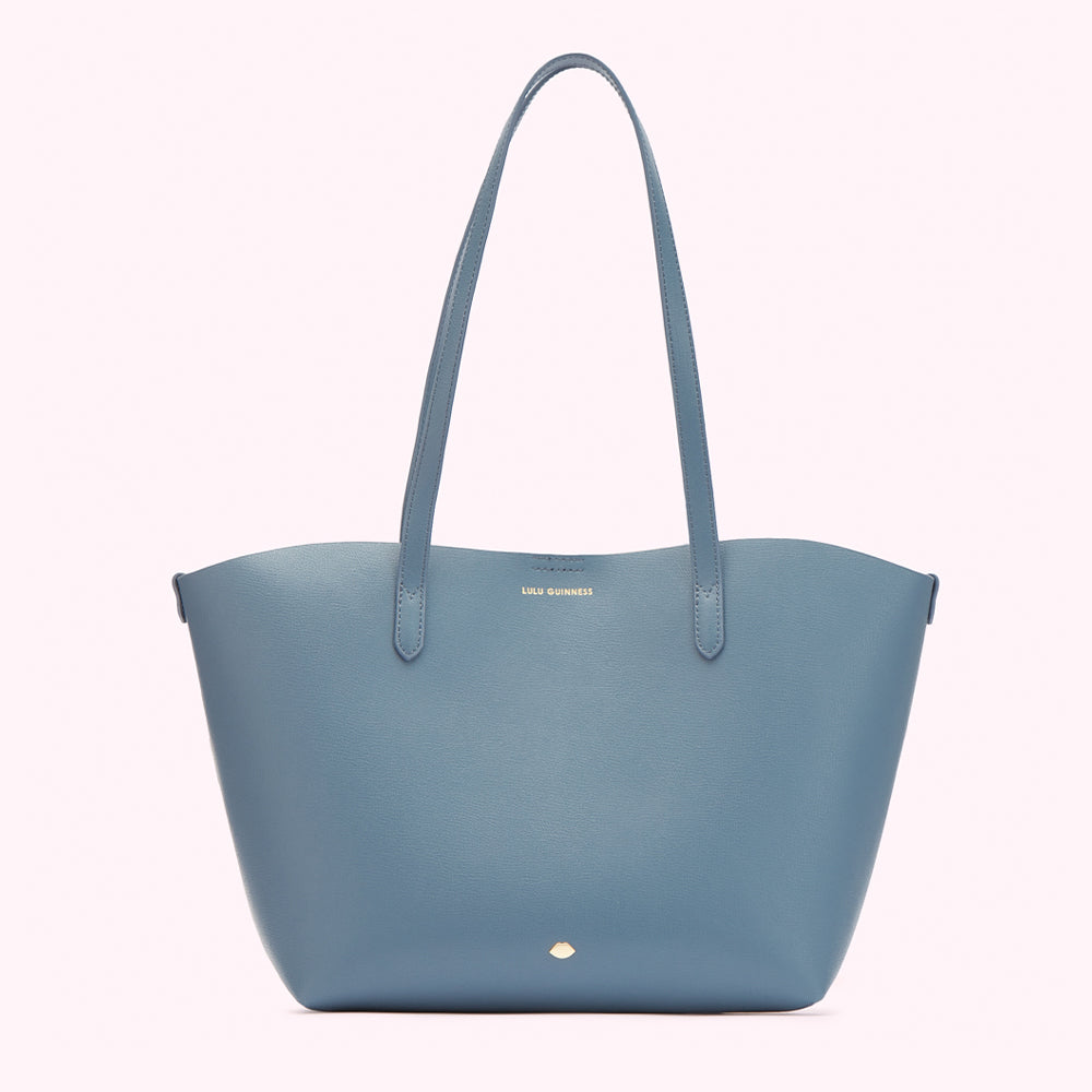 A light blue Lulu Guinness tote bag on a white background.