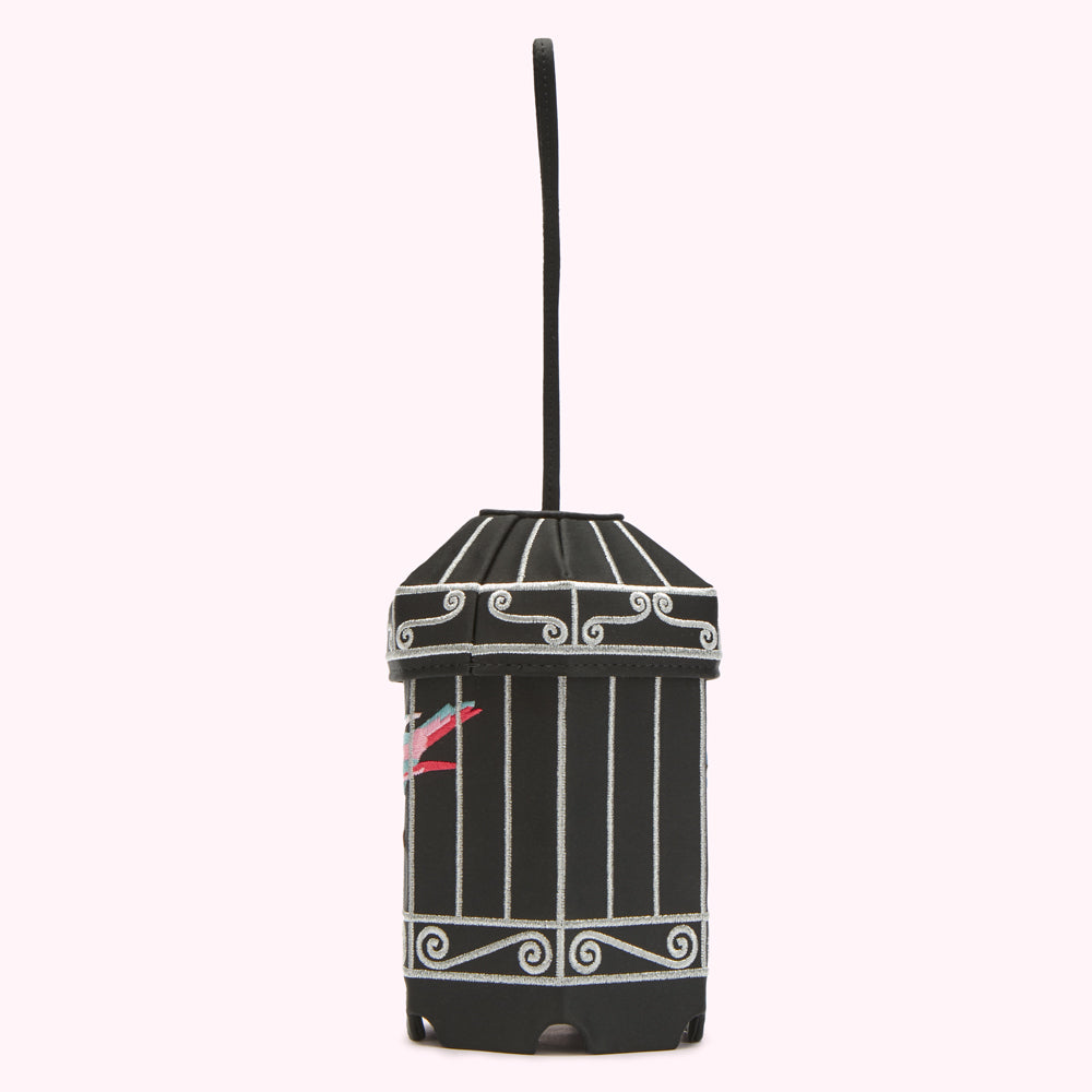 Black birdcage-shaped bag with silver detailing and a small embroidered bird.