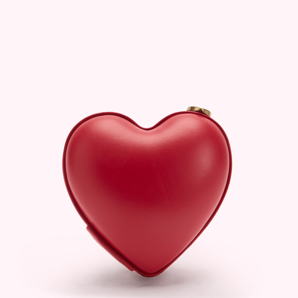 Red heart-shaped bag on white background.

