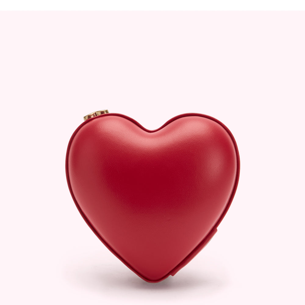 Red heart-shaped purse on white background.