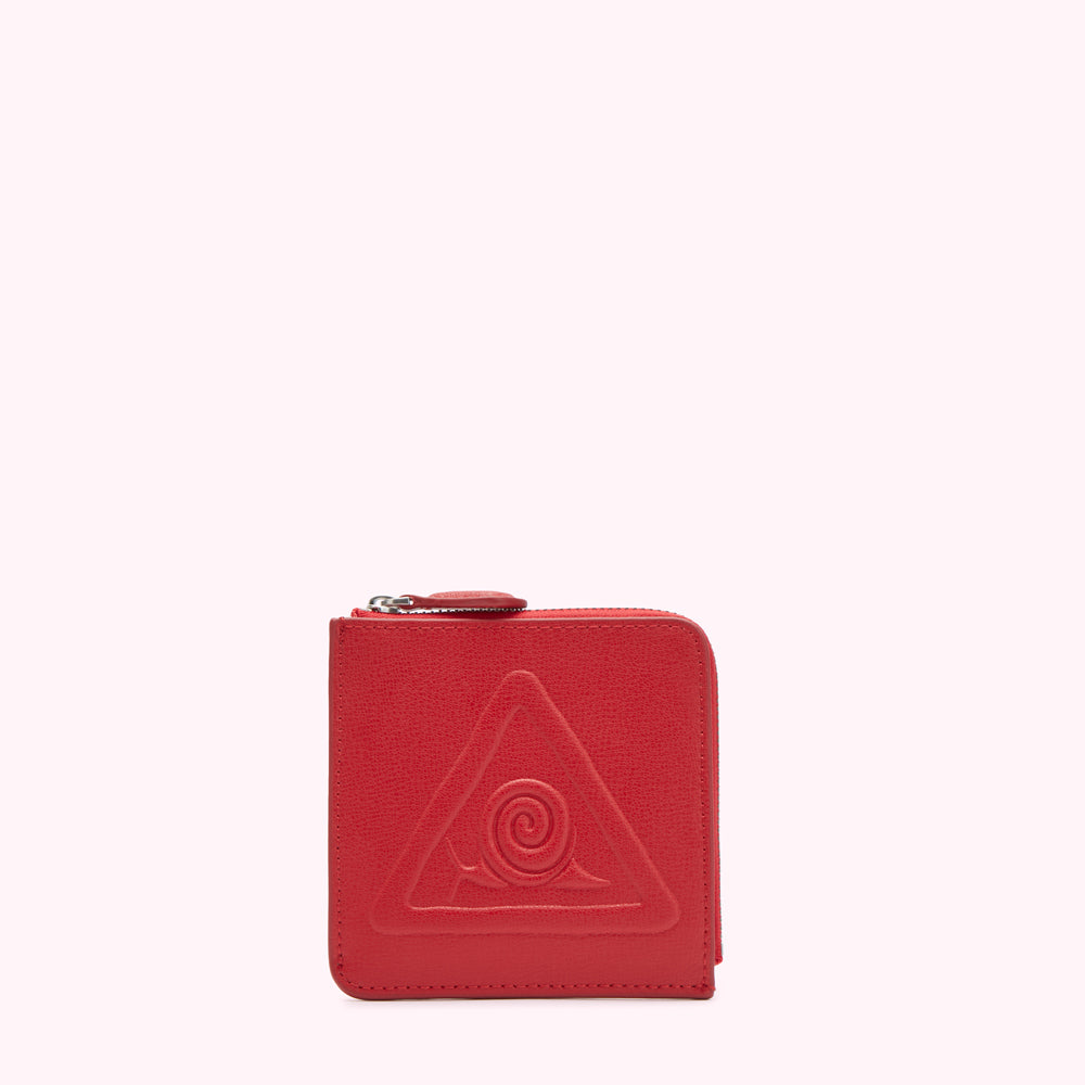 Red leather zip-around wallet with embossed triangle and spiral design.
