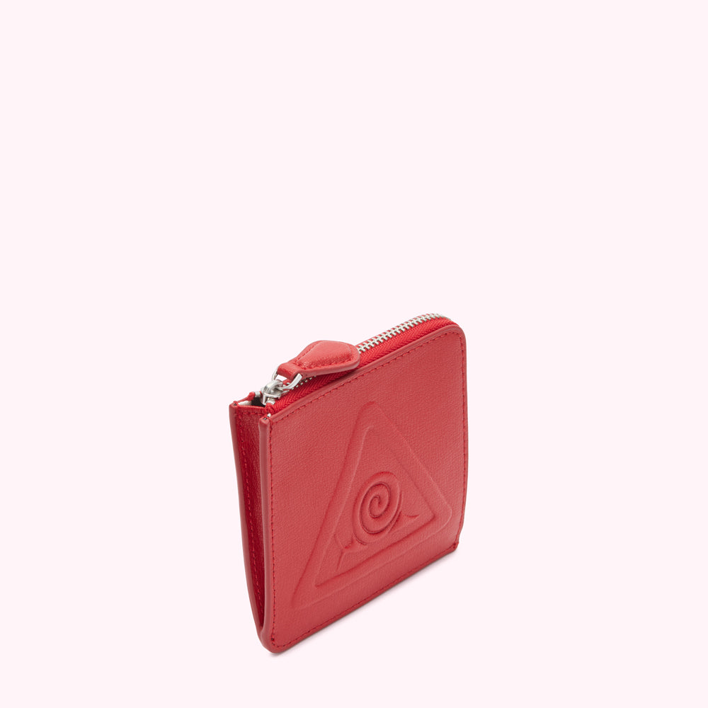 Red leather zip wallet with embossed triangle and spiral design.
