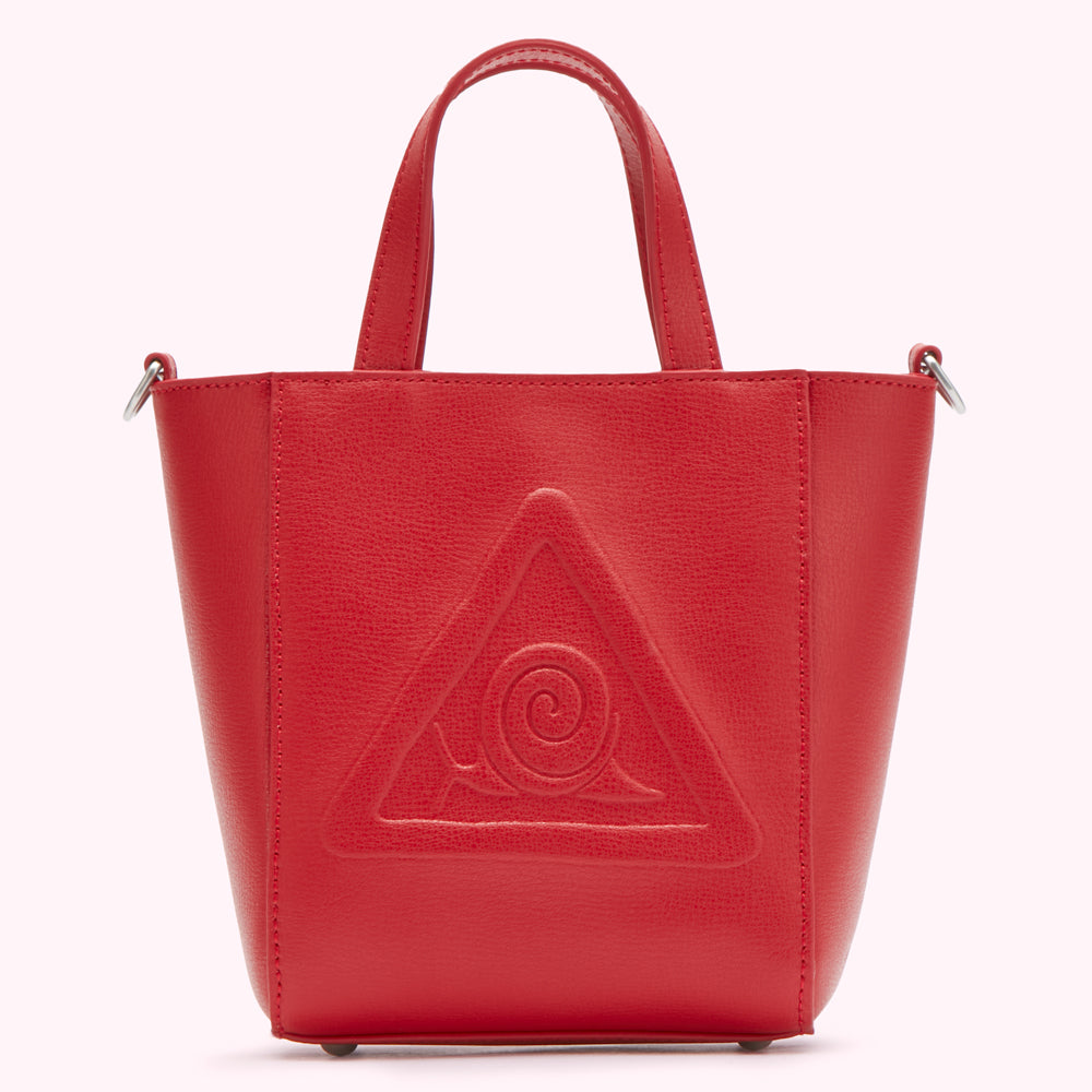 Red leather tote bag with embossed triangle and spiral design.
