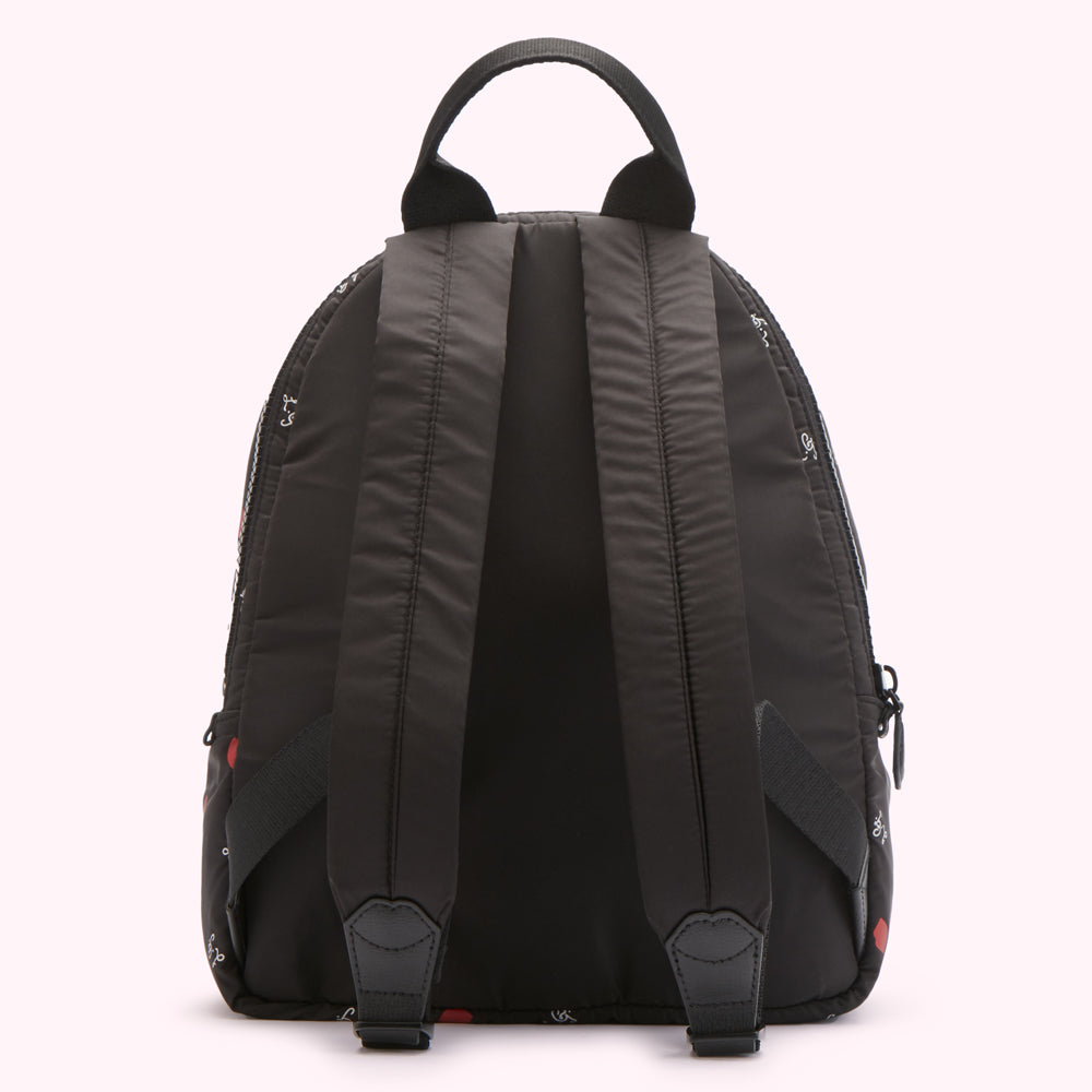 Black backpack with red and white print on a white background.