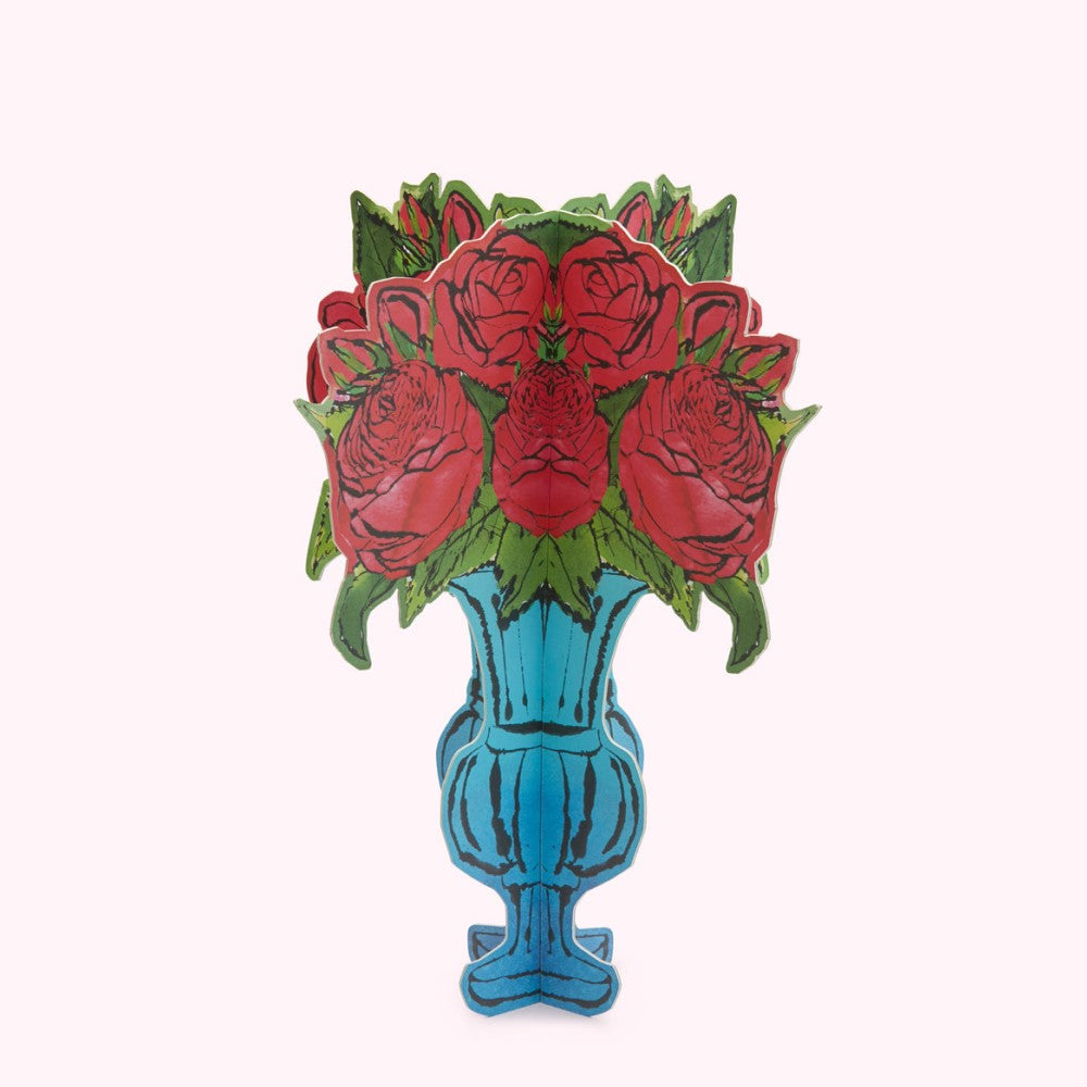 Image of a teal vase with a bouquet of red roses.