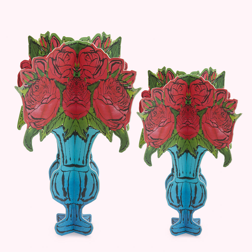 Two vases of red roses, one larger than the other, against a white background.