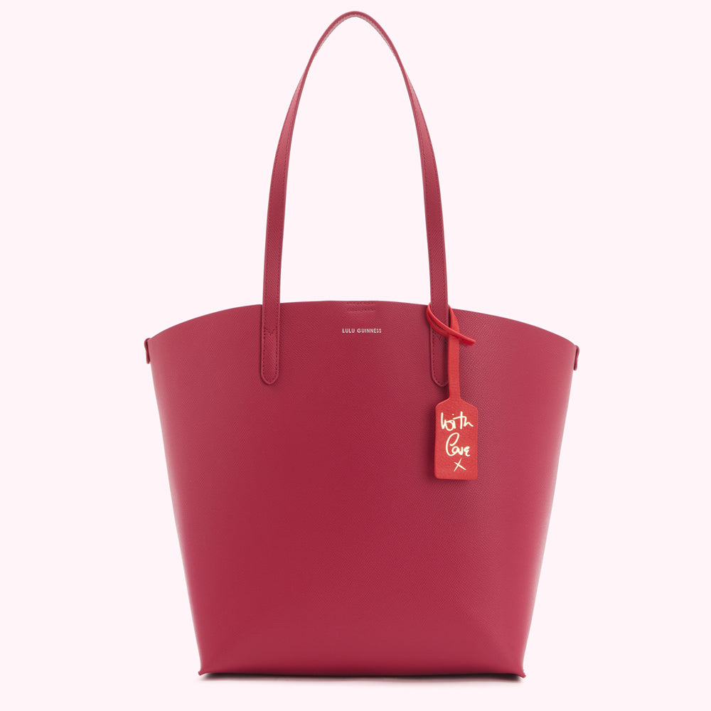Crimson red Lulu Guinness tote bag with a red leather tag that says "with love x" in gold lettering.
