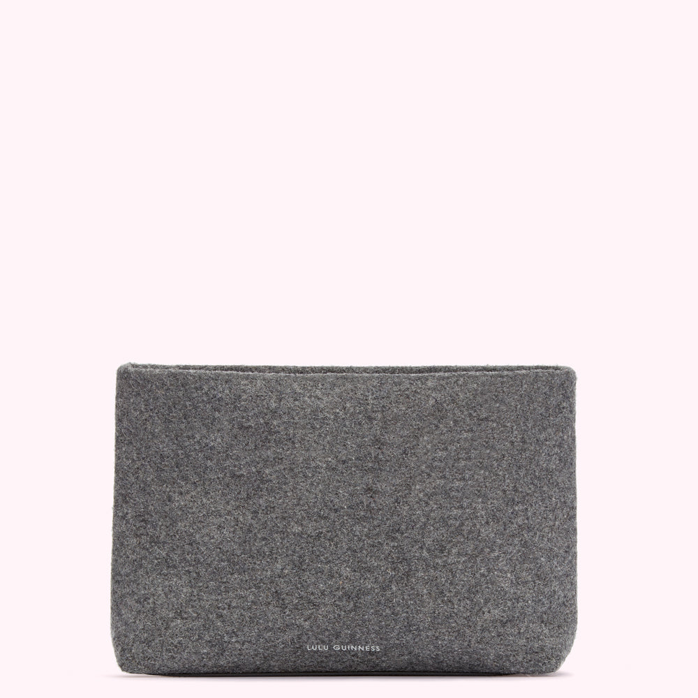 Grey felt Lulu Guinness pouch on a white background.
