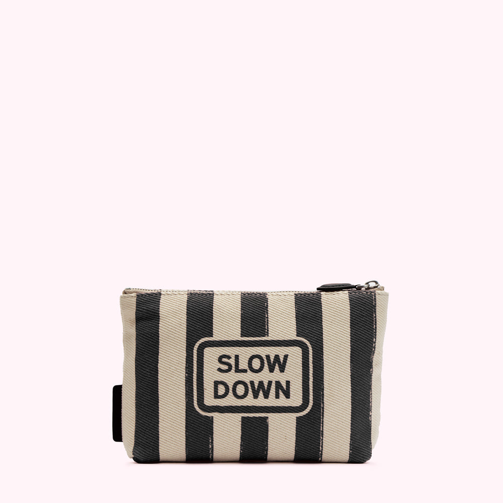 Cream and black striped zippered pouch with "SLOW DOWN" printed on the front.
