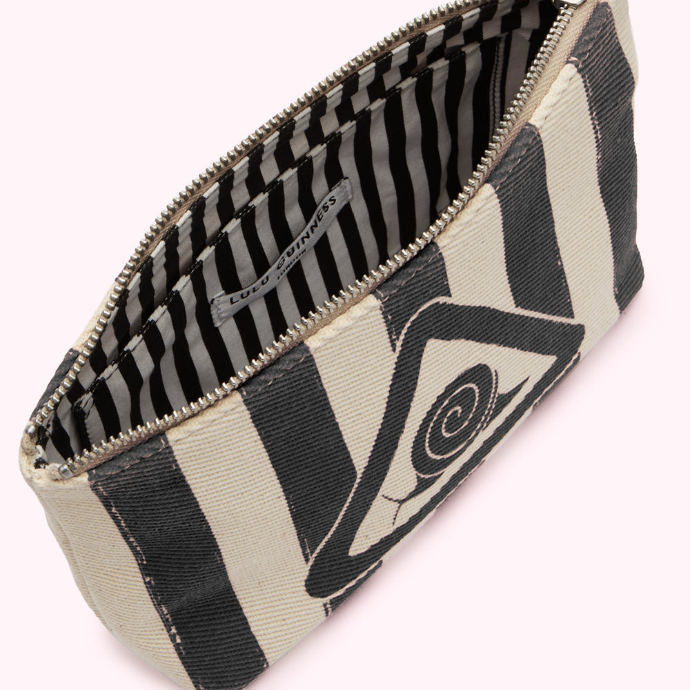 Cream and black striped makeup bag with an eye graphic and Lulu Guinness label visible inside.