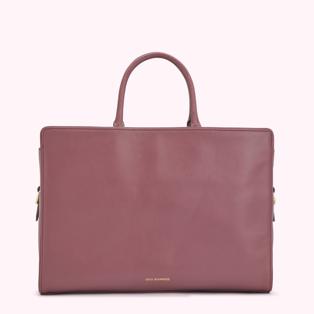 A mauve Lulu Guinness leather tote bag.
