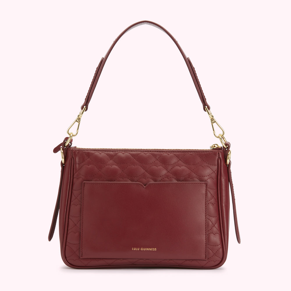 Burgundy quilted leather Lulu Guinness shoulder bag with gold hardware and a small back pocket.