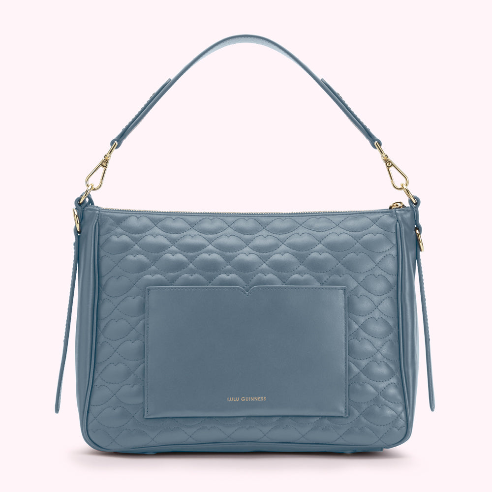 Dusty blue quilted leather Lulu Guinness shoulder bag with gold hardware and lip pattern.
