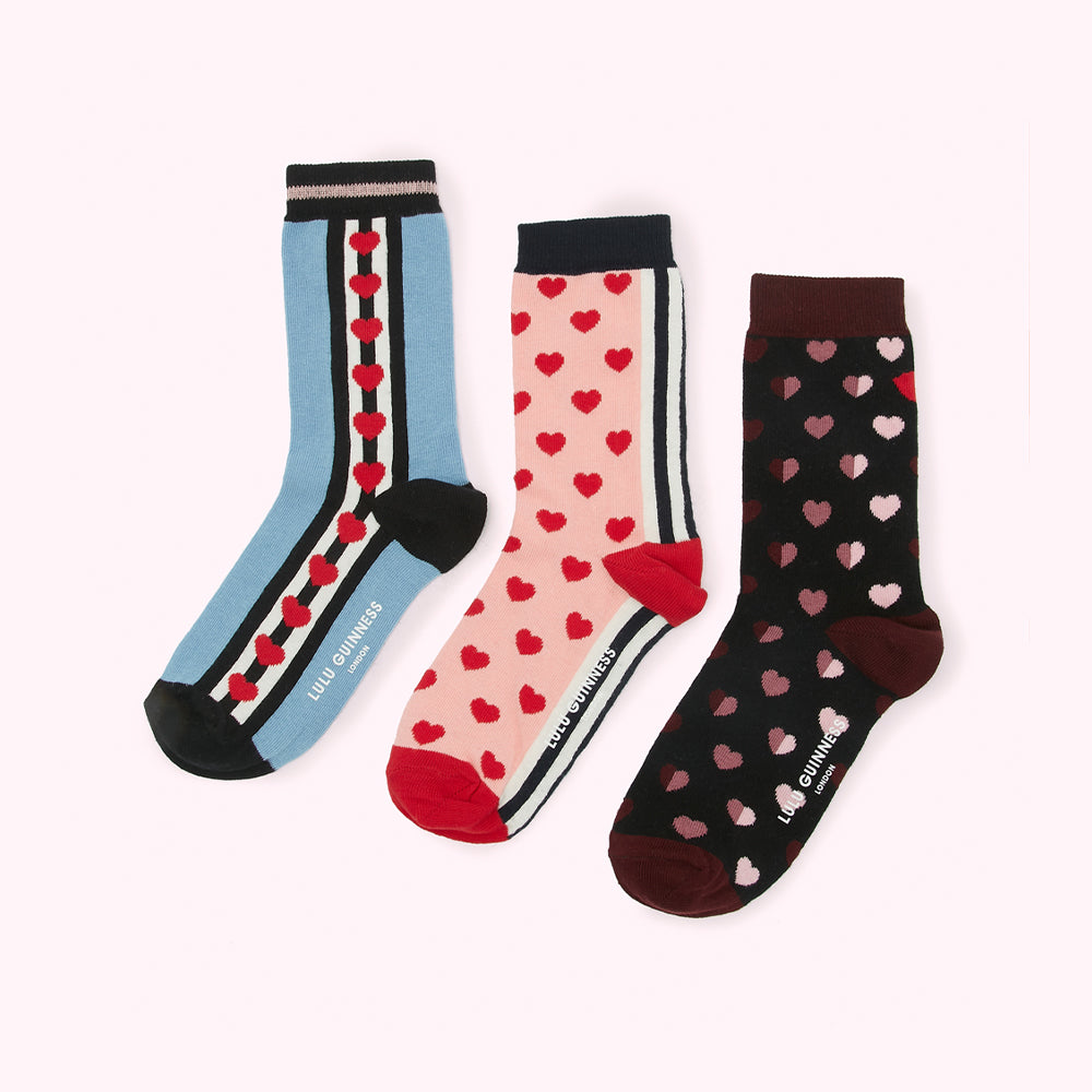 Three pairs of Lulu Guinness socks with heart patterns on a white background.