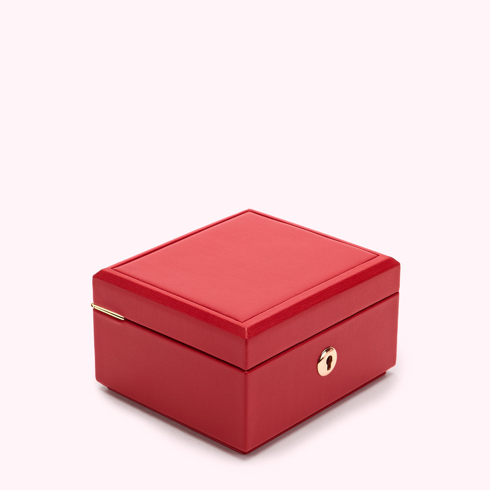 Red square box with gold clasp.
