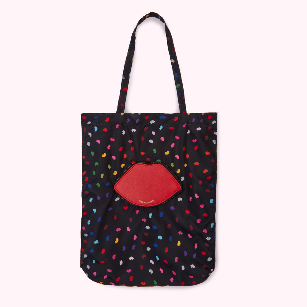 Black tote bag with a red lip design and multi-coloured lip print.