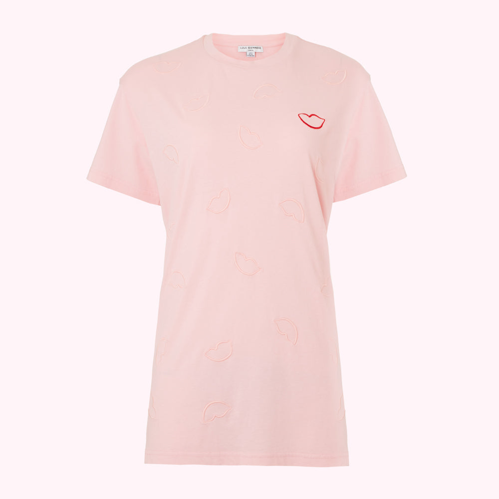 Pink t-shirt with embroidered lip design.