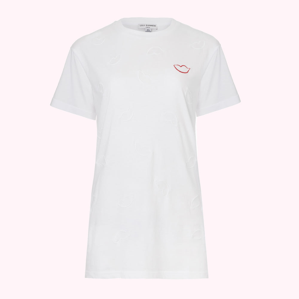White cotton t-shirt with embossed lips and a single red embroidered lip.
